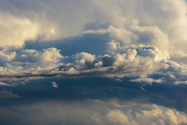 Beautiful stormy cumulus clouds in the sky, background