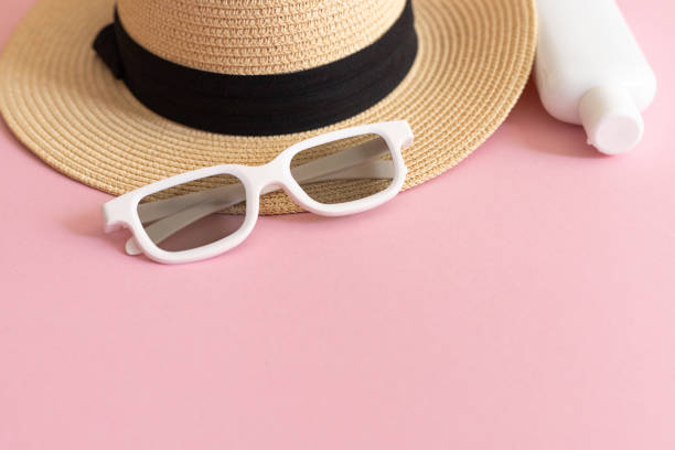 istock flat lay with straw hat, sunglasses and spf cream 2177662356