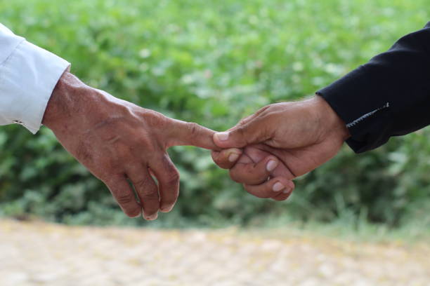 istock A men holing a finger after handshake , handshake between two professionals 2177666801