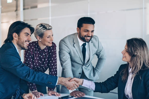 istock Businesswoman shaking hands with a coworker in office work space 2177668269
