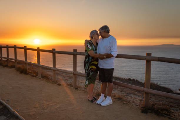 istock Elderly couple romancing at sunset at Cabo Espichel 2177671324