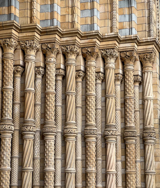 Close-up of intricately carved stone columns showcasing detailed patterns and craftsmanship. The symmetrical design highlights the architectural beauty and historical significance of the structure.