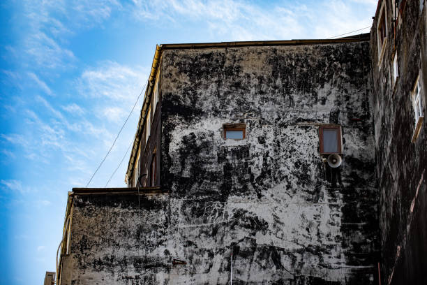 Black painted stained exterior of a very old building