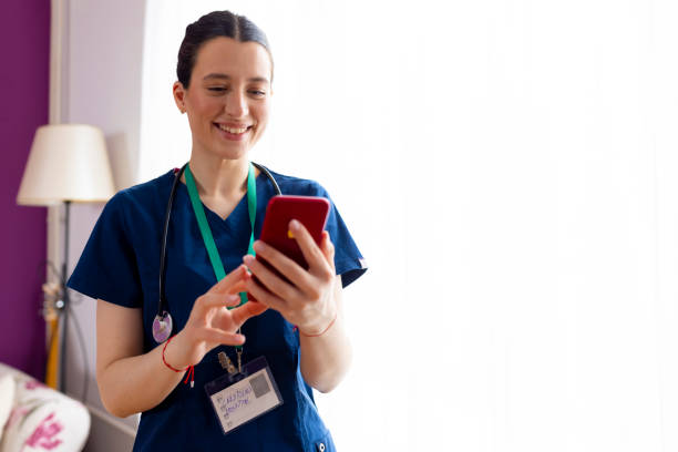 istock A young woman doctor using mobile phone 2177672661