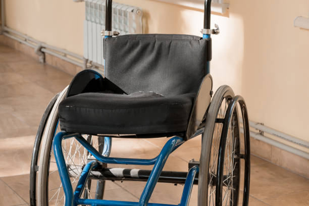 istock A Quiet Moment: An Abandoned Wheelchair in Sunlit Corridor 2177672822