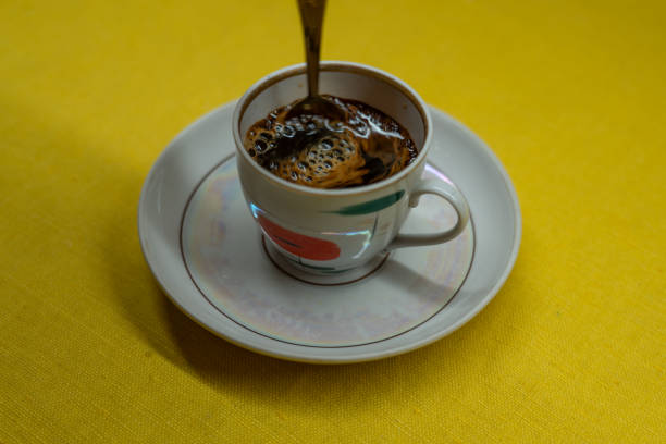 Dish coffee towel with cup and spoon and coffee with sugar and dry milk