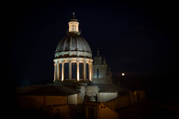 Via della Conciliazione leading towards Vatican City in downtown Rome Italy illuminated at dawn.