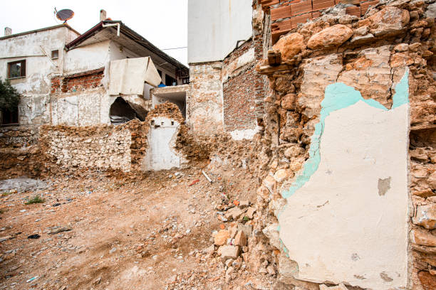 istock Worn out wall of old stone and brick house 2177674071