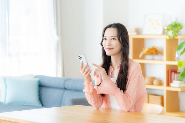 istock A woman operating a smartphone in the room 2177674082