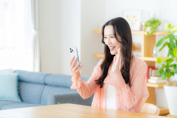 istock A woman operating a smartphone in the room 2177674090