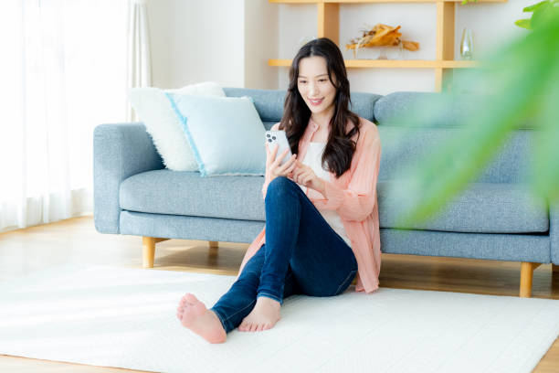 istock A woman operating a smartphone in the room 2177676532