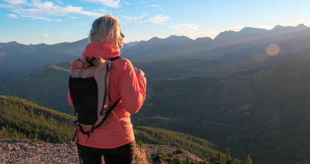 istock Mature woman hikes along mountain ridge 2177677768