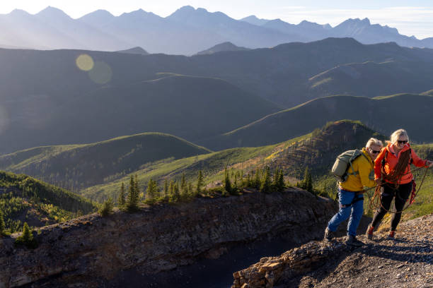 istock Mature mountain climber offers helping hand 2177677845