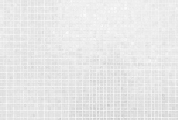 istock White tile wall chequered background bathroom texture. Ceramic brick wall and floor tiles mosaic background in bathroom and kitchen clean. Design pattern geometric with grid wallpaper decoration. 2177680990