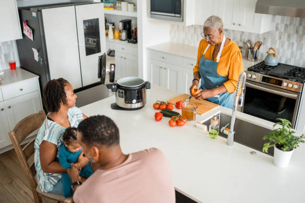 istock Family Cooking Together in Home Kitchen 2177681099