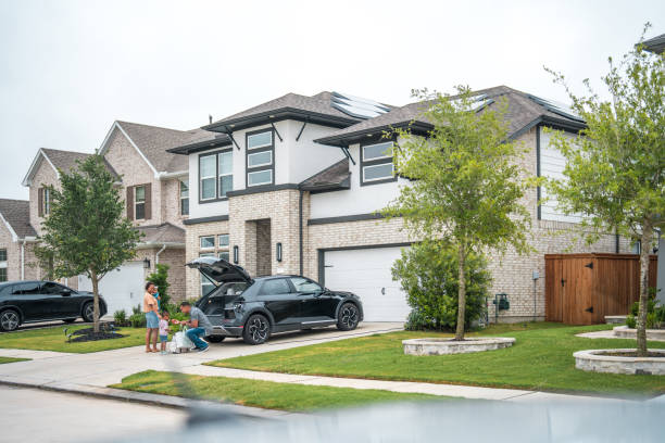 istock Diverse Family Engages in Unloading Groceries by Eco-Friendly Home 2177681108