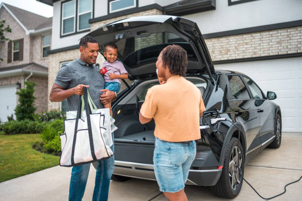 istock Diverse Family Unloading Groceries by Eco-Friendly Home 2177681111