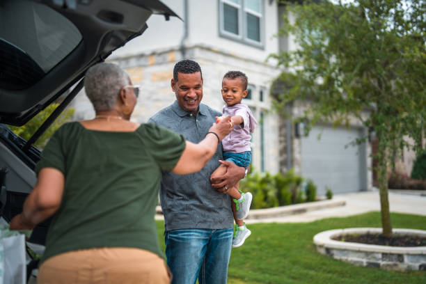 istock Sustainable Living: Multigenerational Family with Electric Car 2177681116