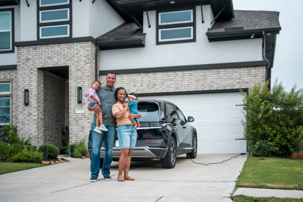 istock Diverse Family with Eco-Friendly Home and Car 2177681119