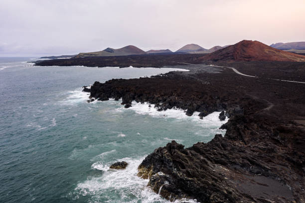istock foamy sea breaking over the volcanic coast 2177681137