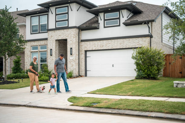 istock Diverse Family Enjoying a Walk by Eco-Friendly Home 2177681143
