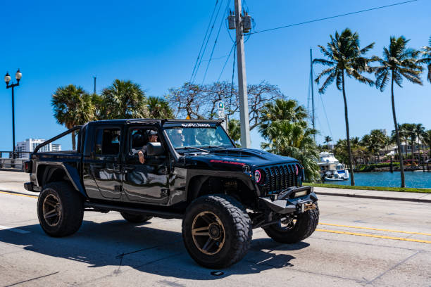 Fort Lauderdale, Florida, USA - March 25, 2023: Jeep Gladiator luxury sportscar car, side view.