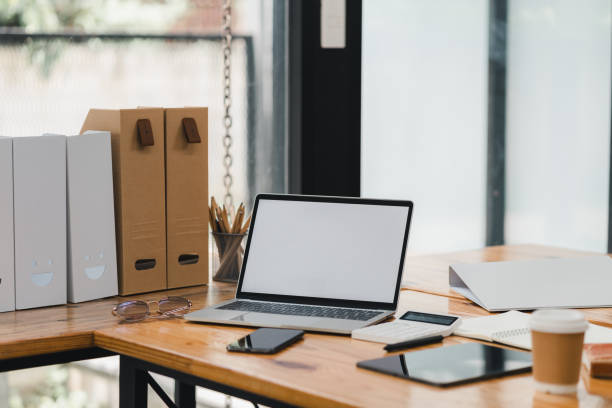 istock A modern workspace featuring laptop, stationery, and coffee, creating productive atmosphere. 2177683994