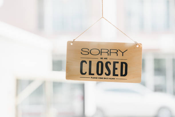 istock Closed sign hanging in window, inviting customers to return later. 2177684284