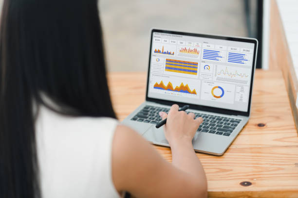 istock Businesswoman or an accountant team are analyzing data charts, graphs, and a dashboard on a laptop screen in order to prepare a statistical report and discuss financial data in an office. 2177684427