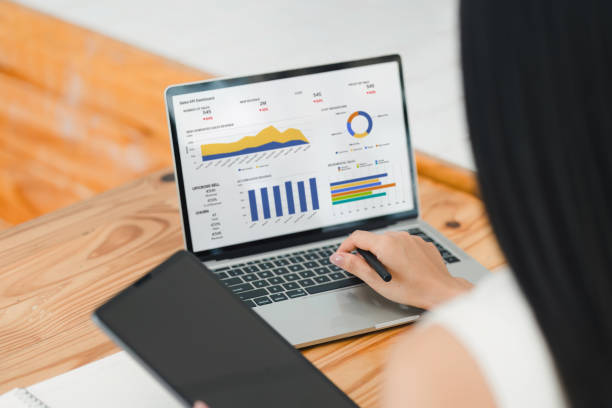 istock Businesswoman interacts with a digital sales dashboard displaying various performance metrics and analytics. 2177684430