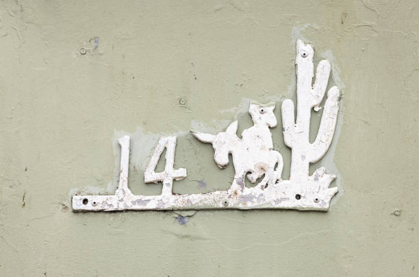 Classic Australian “Mexican style” house number with a man in a sombrero riding a donkey next to a cactus plant
