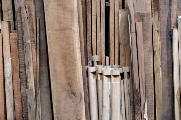 Close-up on planks of timber and pieces of wood at a carpentry shop - no people