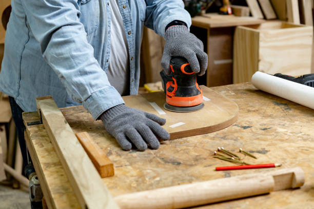 istock Carpenter sanding wood at a carpentry shop 2177689413
