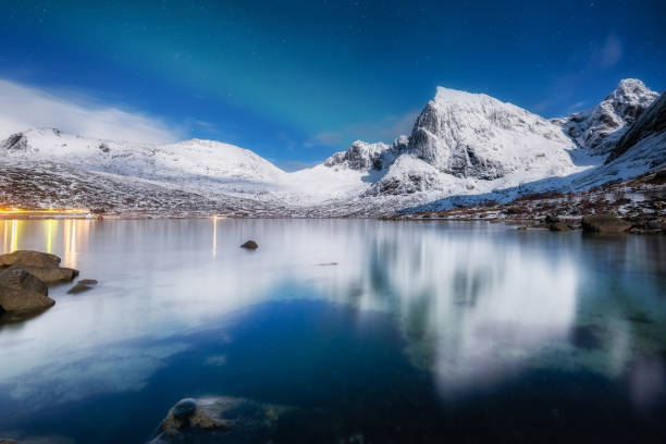 istock Lofoten islands, Norway. Panoramic landscape. Moon light. Long exposure photography. Reflection on the water surface. Winter night landscape with starry sky. 2177691230