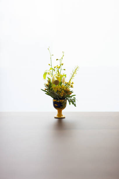 istock plant in a vase on a wooden table 2177692380