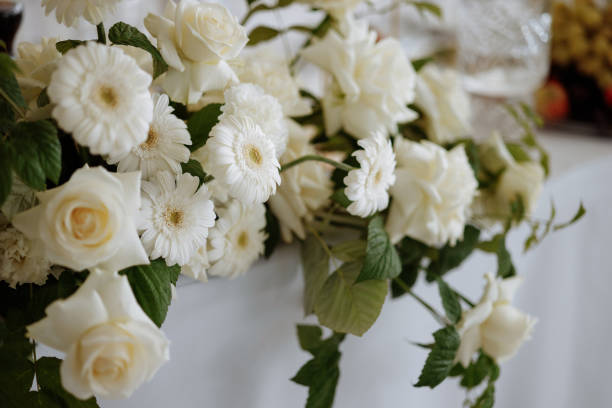 istock A bouquet of white roses and daisies 2177699095