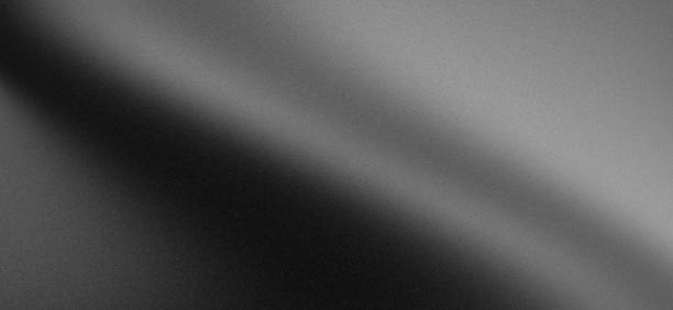 istock Blurry abstract grainy grey divided gradient gray dark monochrome background with noise texture 2177704694