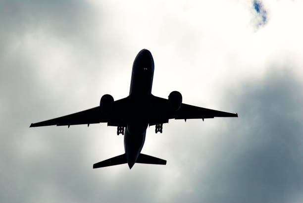 A Boeing 777 passenger airplane approaches Washington Dulles International Airport ending an international flight on a stormy day.