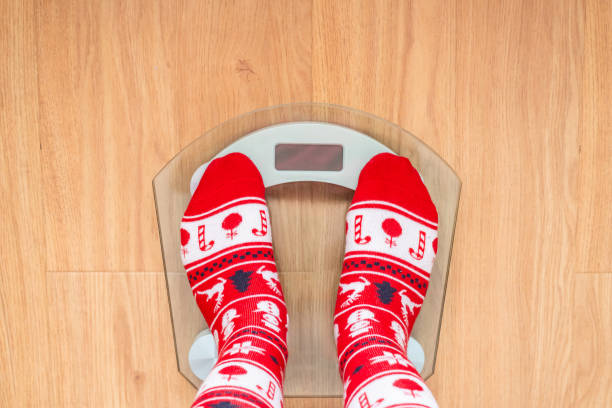 istock Feet With Christmas Socks On Scale. 2177708919