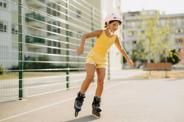 istock Cute little girl rides roller skates 2177710256
