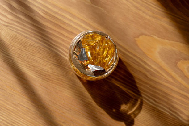 istock vitamin D capsuleson wooden background. 2177711263