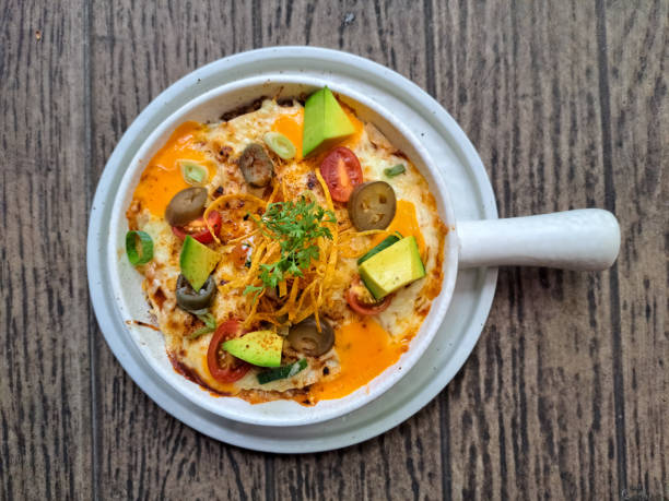 Enchiladas With Tortilla Flour, Minced Beef Mozarella Cheese, Cheese White Cheddar, Tomato Cherry, Avocado, Pickel, Jalapeno Picklel, Leek And Yoghurt. Food Menu. Top View.