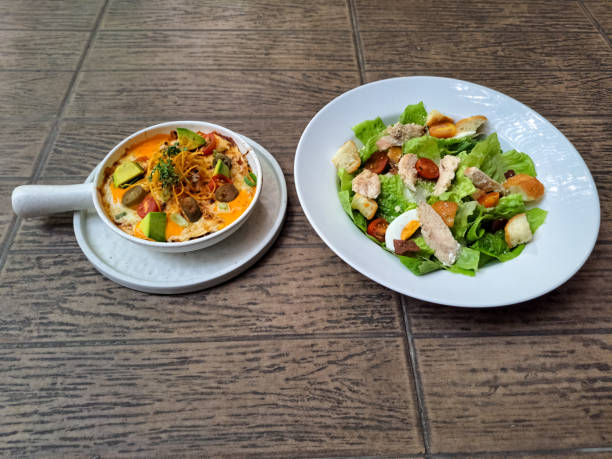 istock Enchiladas With Tortilla Flour, Minced Beef Mozarella Cheese, Cheese White Cheddar, Tomato Cherry, Avocado, Pickel, Jalapeno Picklel, Leek And Yoghurt. Caesar Salad With Mix Greens, Egg, Roasted Chicken Breast, Parmesan Cheese, Caesar Dressing. Food Menu. 2177711909