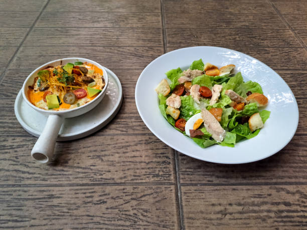 istock Enchiladas With Tortilla Flour, Minced Beef Mozarella Cheese, Cheese White Cheddar, Tomato Cherry, Avocado, Pickel, Jalapeno Picklel, Leek And Yoghurt. Caesar Salad With Mix Greens, Egg, Roasted Chicken Breast, Parmesan Cheese, Caesar Dressing. Food Menu. 2177712069