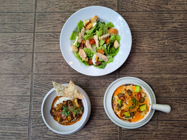 istock Caesar Salad With Chicken Tikka Masala And Enchiladas. Food Menu. Top View. 2177712206