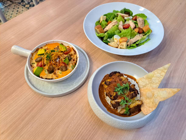 istock Enchiladas With Chicken Tikka Masala And Caesar Salad. Food Menu. 2177712859