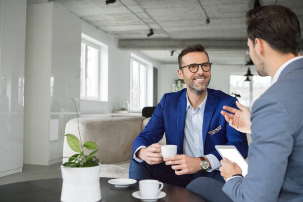 istock Confident male professionals discussing at office 2177714555