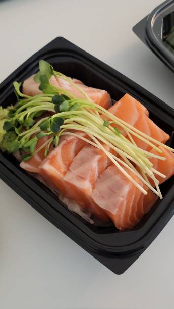 istock Sushi Set of sashimi and sushi rolls served on a plate 2177716218