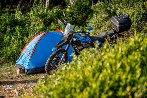 istock Blue tent and motorcycle next to it in the forest 2177717006