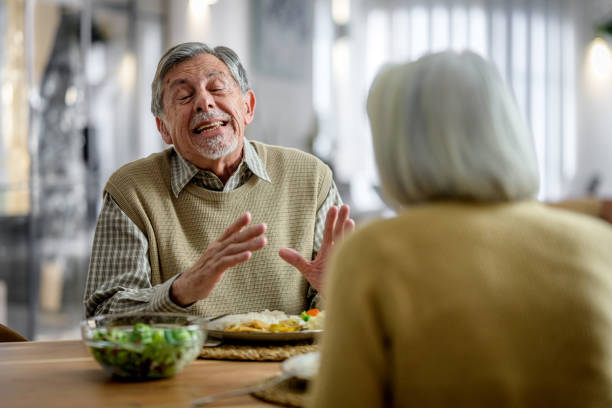 istock Senior Couple Shares Meal in Cozy Home Setting 2177719030